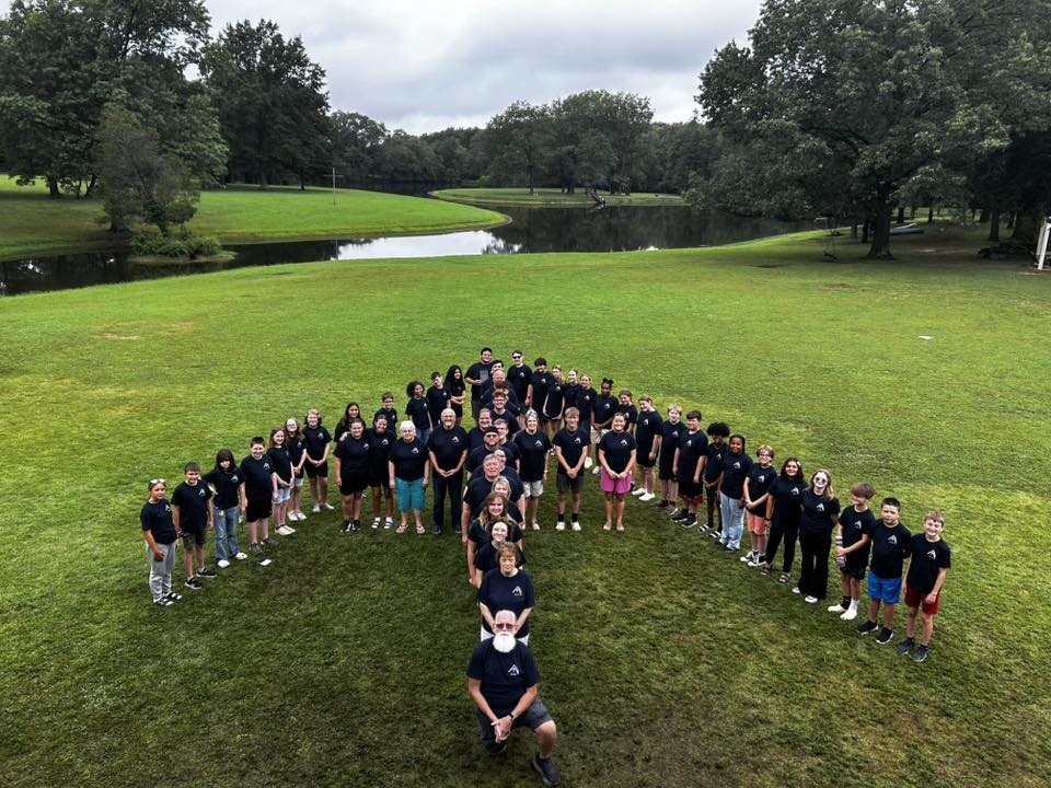 Junior High Week 2025 campers in heart formation